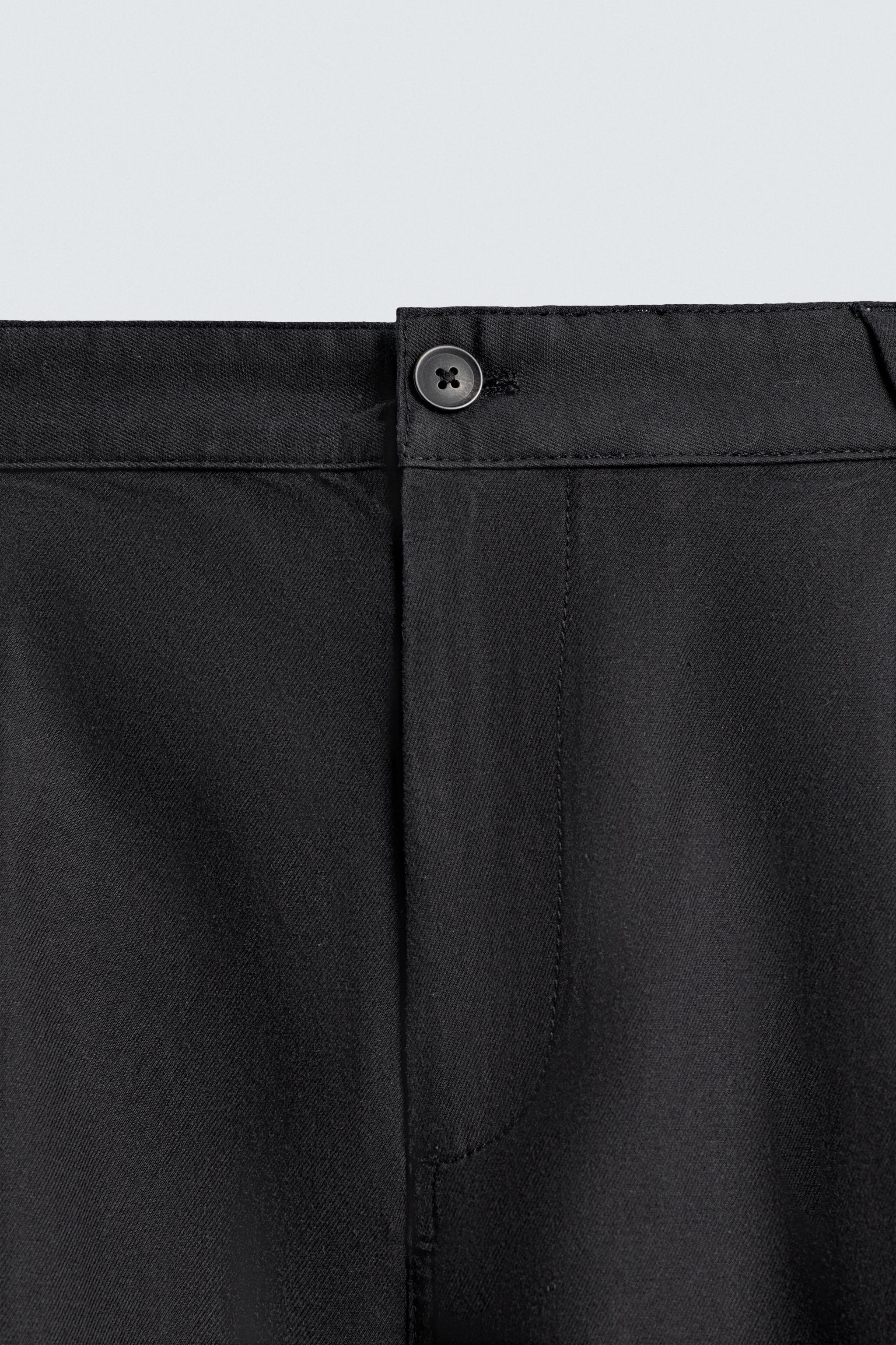 RELAXED FIT PLEATED PANTS